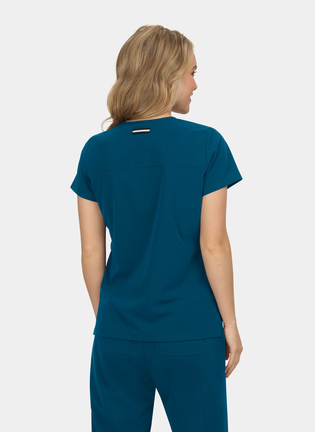 Blouse médicale femme Koi Next Gen Agitation et passion bleu caraibes dos